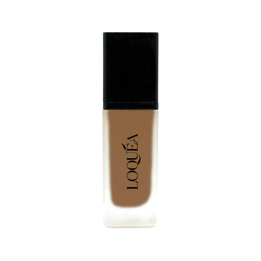 Makeup bottle with black cap and brown body on a white background